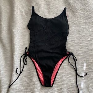 Black swimsuit with ties on side.